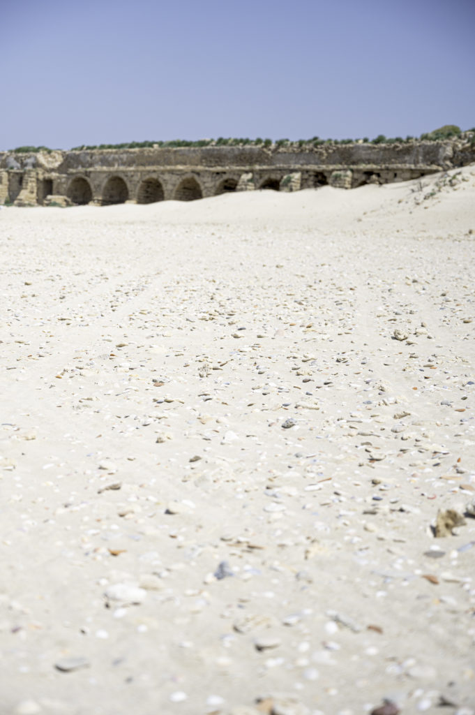Aquaduct in Caesarea on the beach