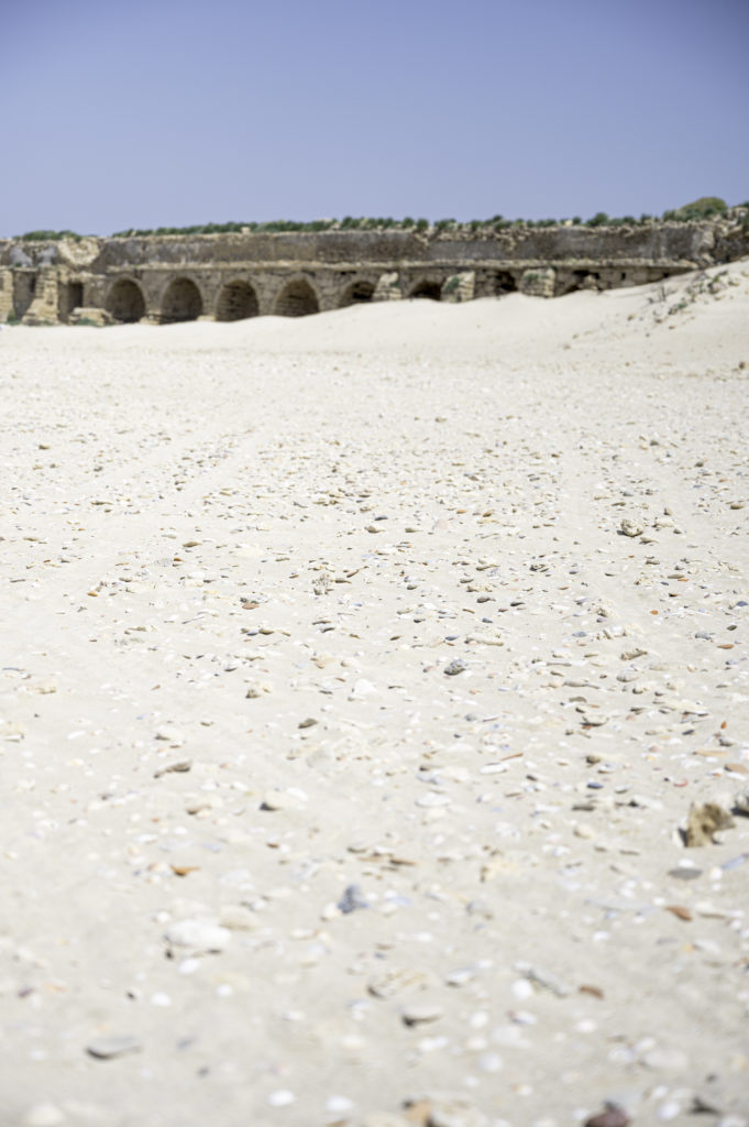 Aquaduct in Caesarea on the beach
